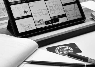 Design tablet with mood board and sketches on a studio desk